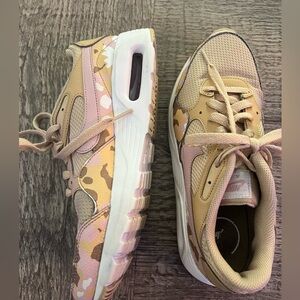 Nike air sneakers.  Yellow and pink camo